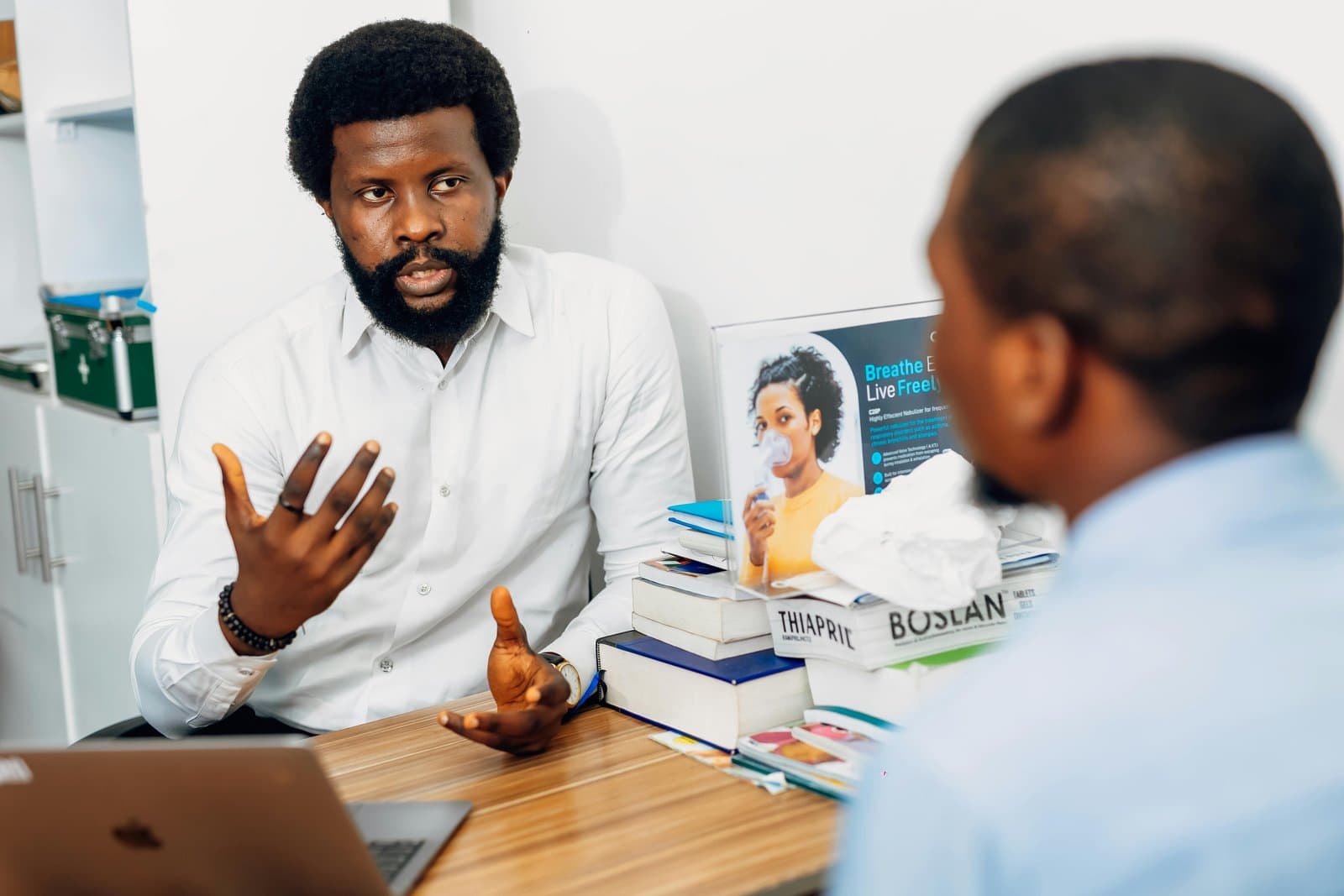 A doctor conducting a consultation in Lagos, Nigeria